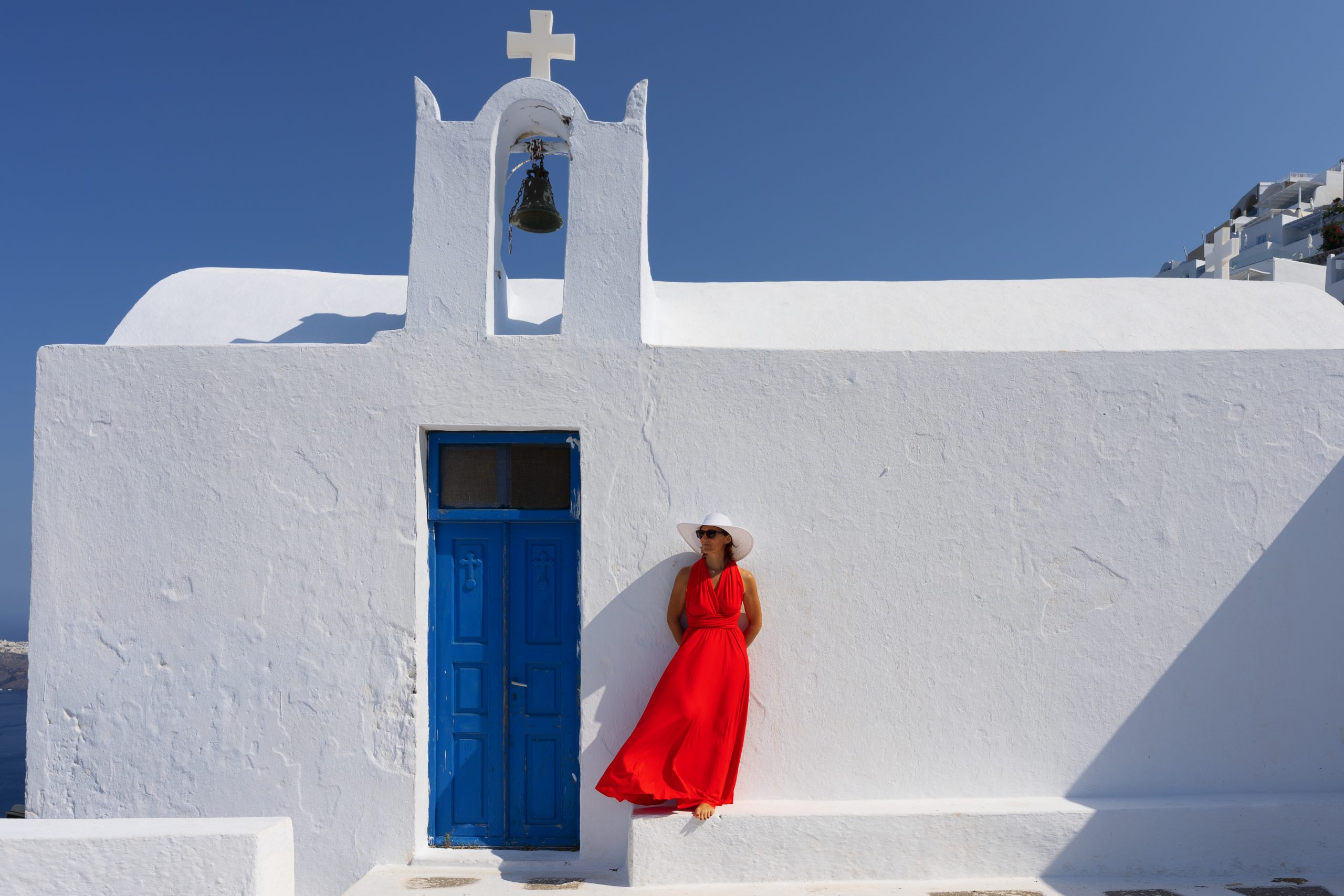 Woman in front of church in santorini, greece